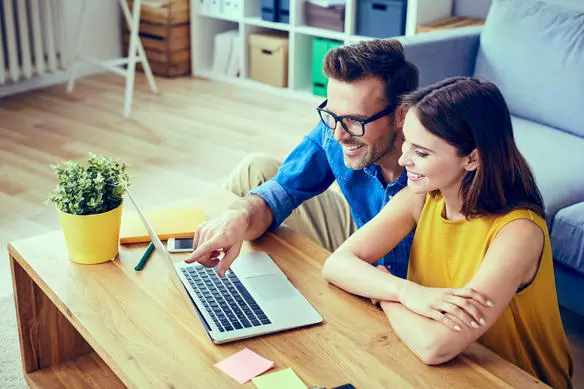 Picture of couple looking at computer